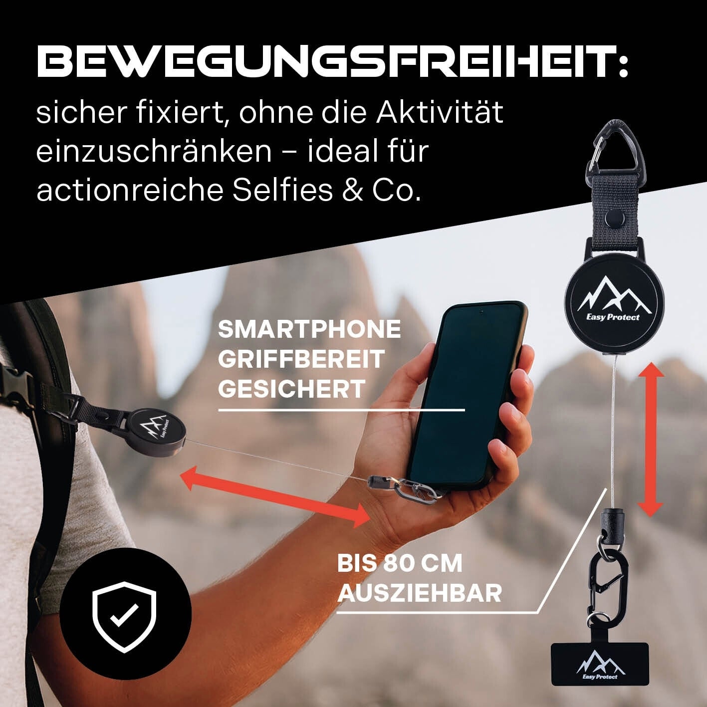Infografik: Person hält ein Smartphone, das mit einem ausziehbaren Sicherungsseil an Kleidung/Tasche befestigt ist; Text „BEWEGUNGSFREIHEIT …“, „Smartphone griffbereit gesichert“, „bis 80 cm ausziehbar“ und Produktdarstellung.